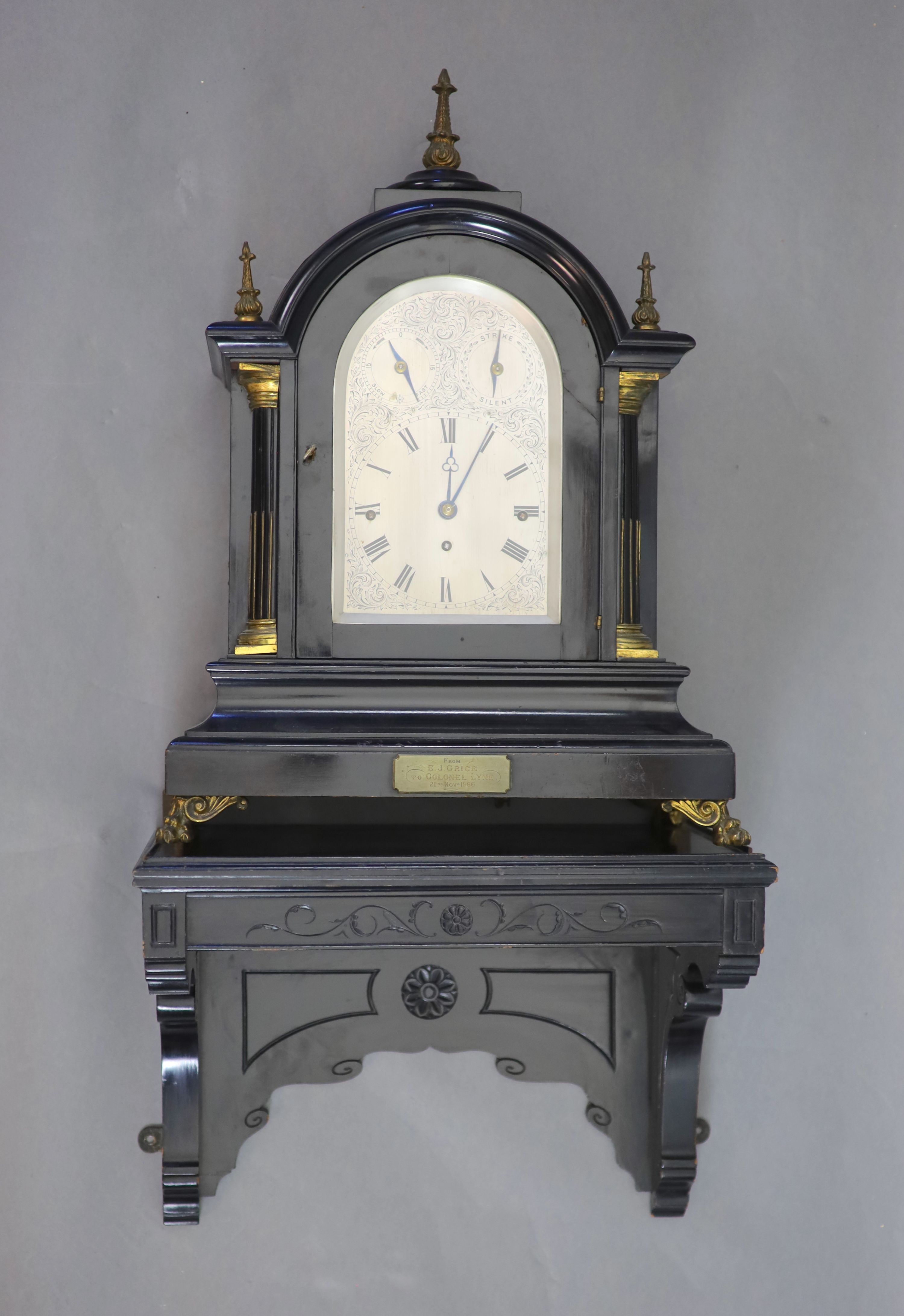 A large late Victorian ebonised bracket clock with bracket